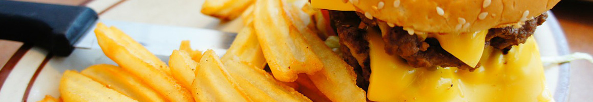 Eating Burger Fish & Chips Seafood at TJ's Seafood Shack restaurant in Oviedo, FL.